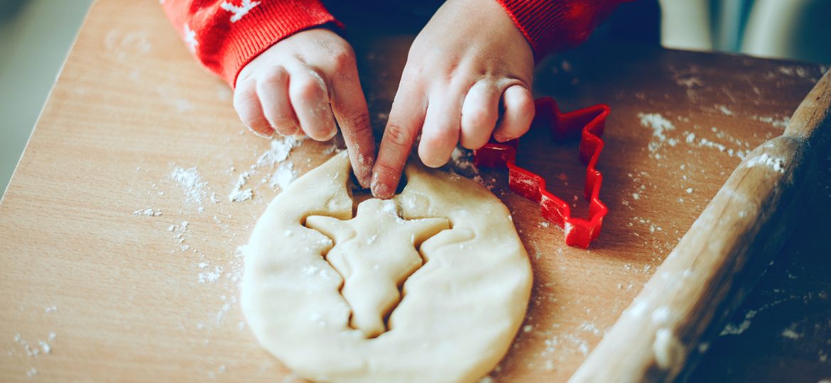 Christmas Preparation Of A Young Kid Making Cookies At Home Wear