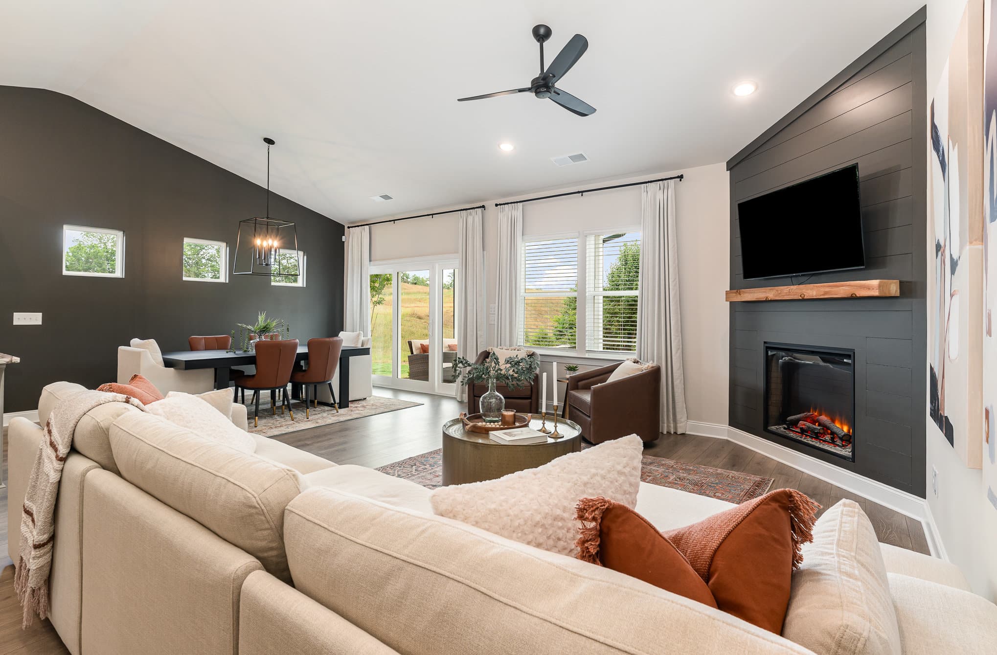 A living area with a fireplace in a home built by patterson company