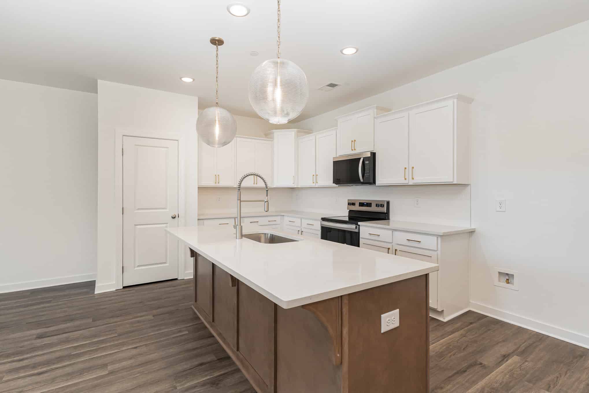 A kitchen island in a somerville home built by patterson company