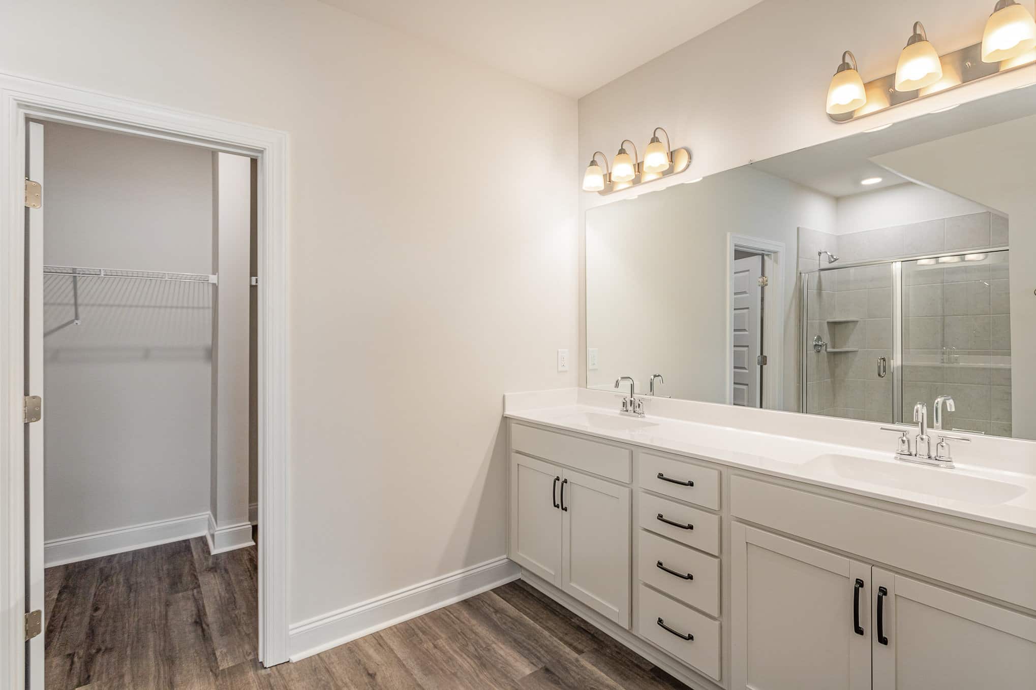 A bathroom in a home by in a home built by patterson company