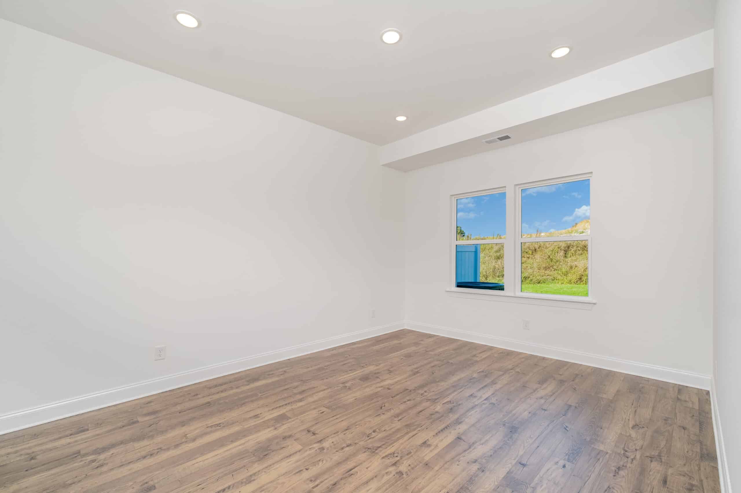 A bedroom in a home built by Patterson Company