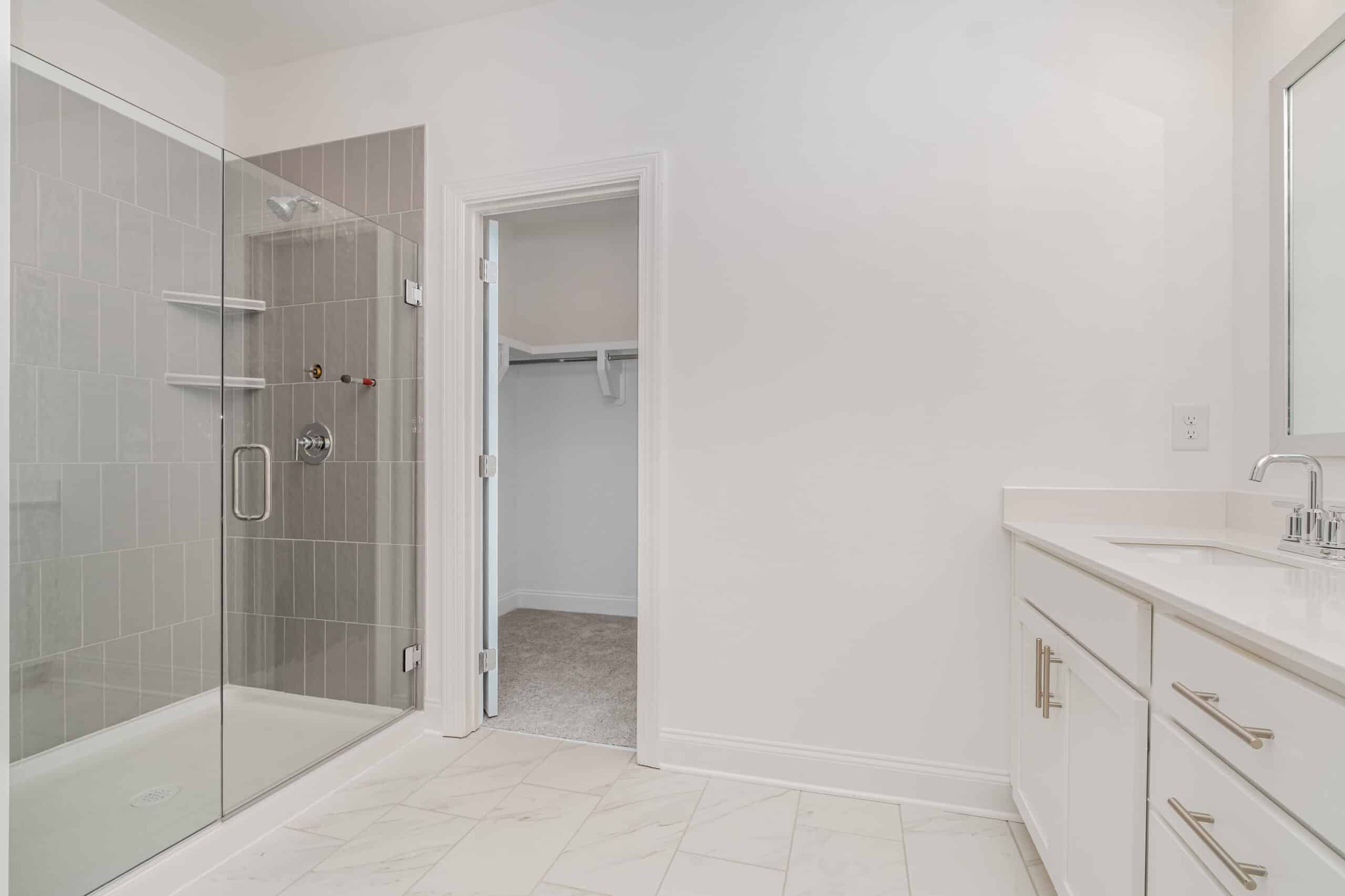 A white bathroom in a home built by Patterson Company