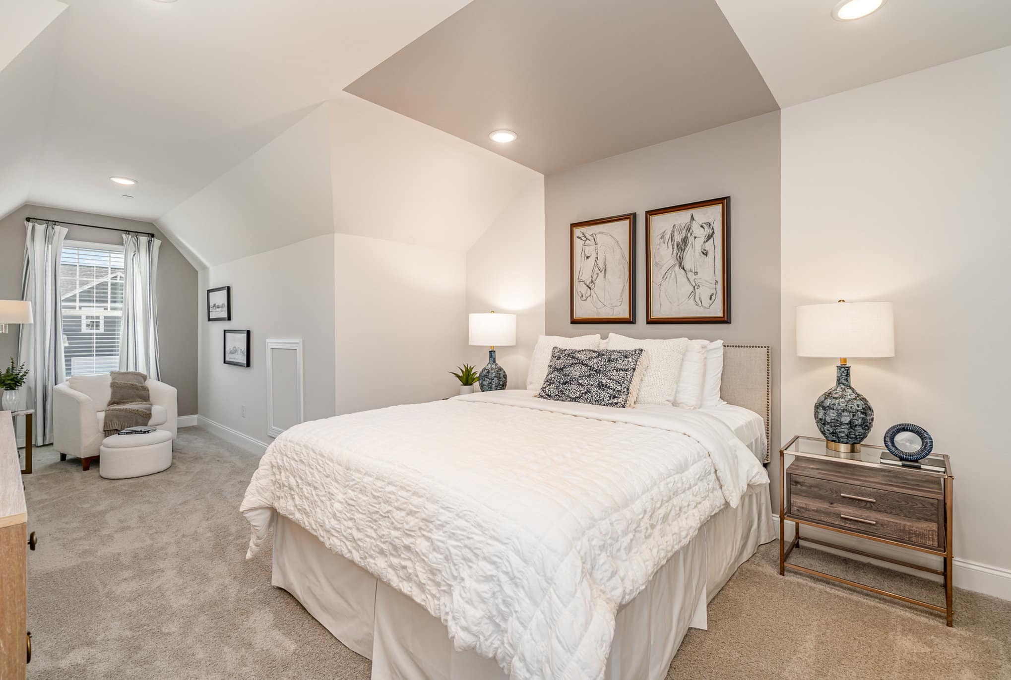 A white bedroom in a home built by Patterson Company