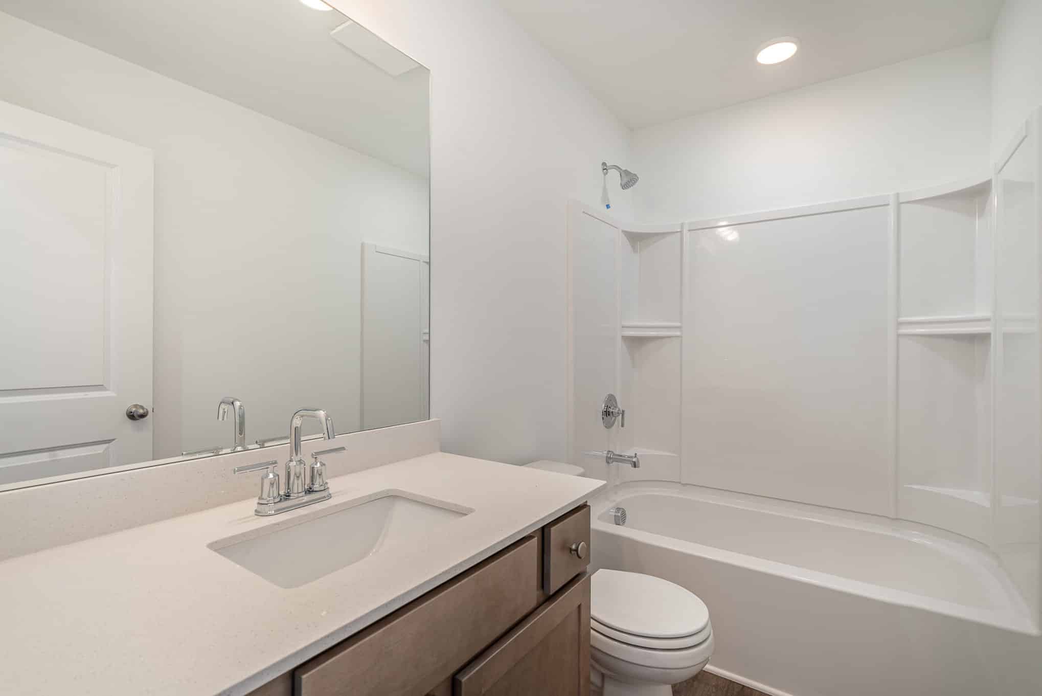 A white bathroom in a home built by patterson company