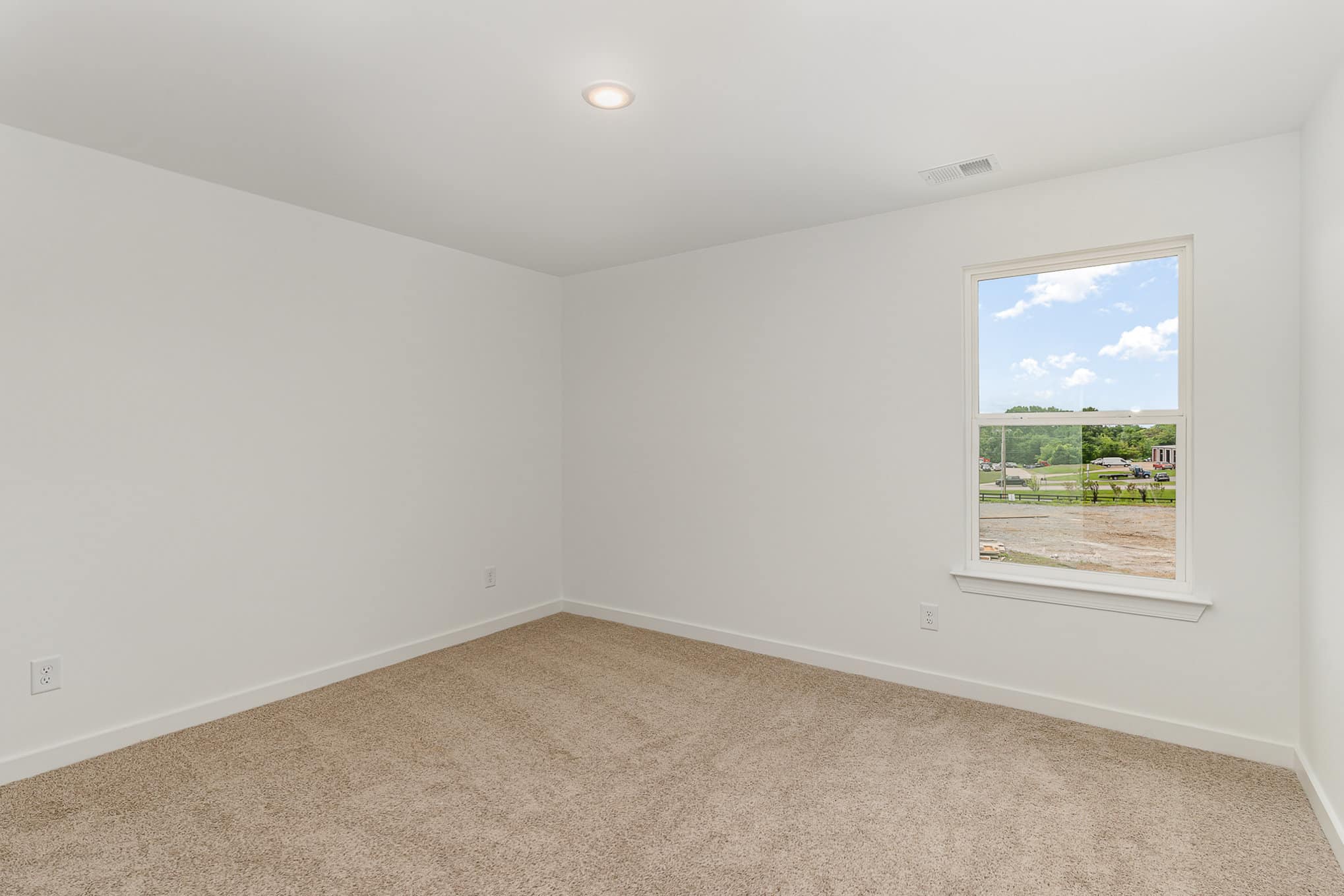 A bedroom in a home built by patterson company