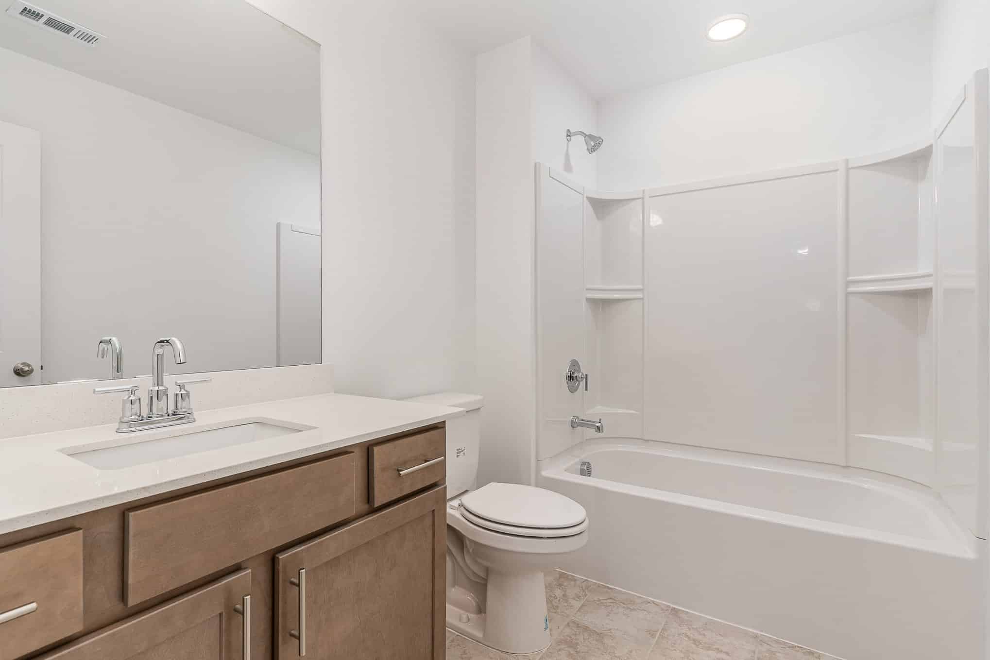A white bathroom in a home built by patterson company