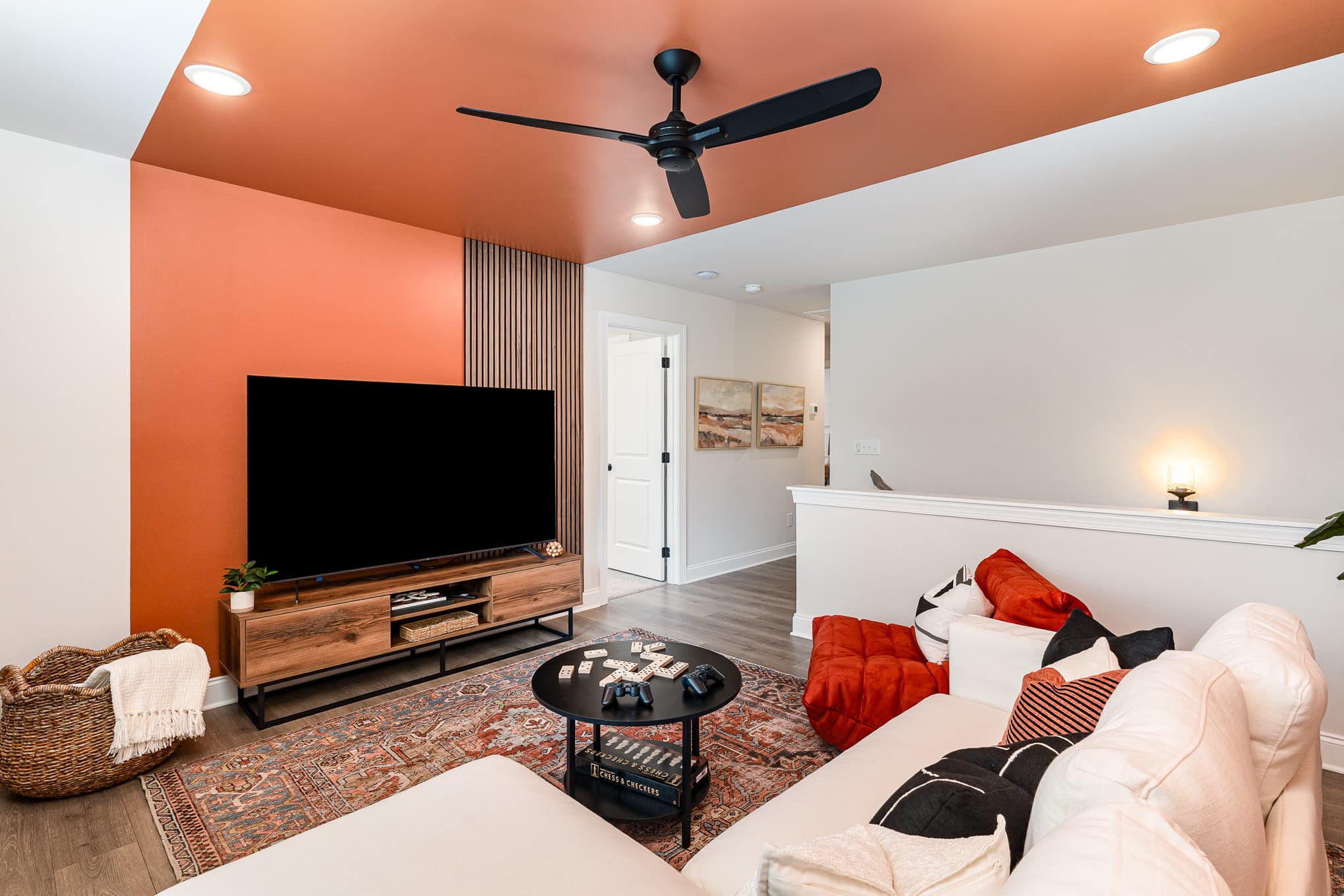 A tv room in a home built by patterson company