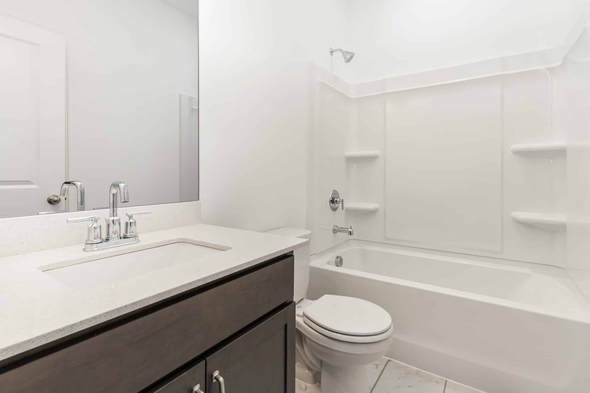 A white bathroom in a home built by patterson company