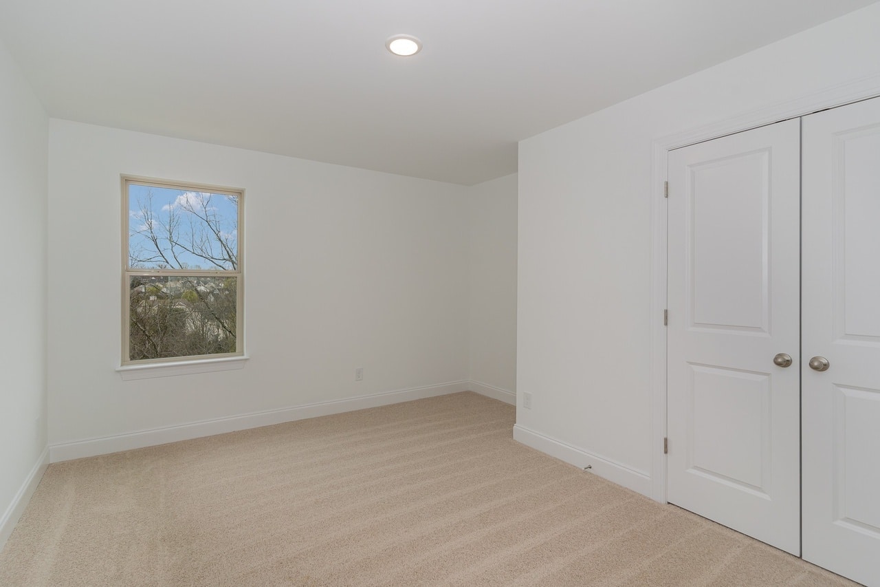 A bedroom in the poplar series home