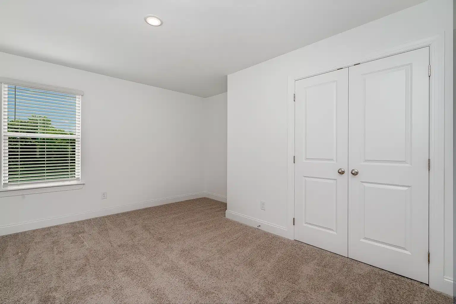 A large closet space in a home built by patterson company