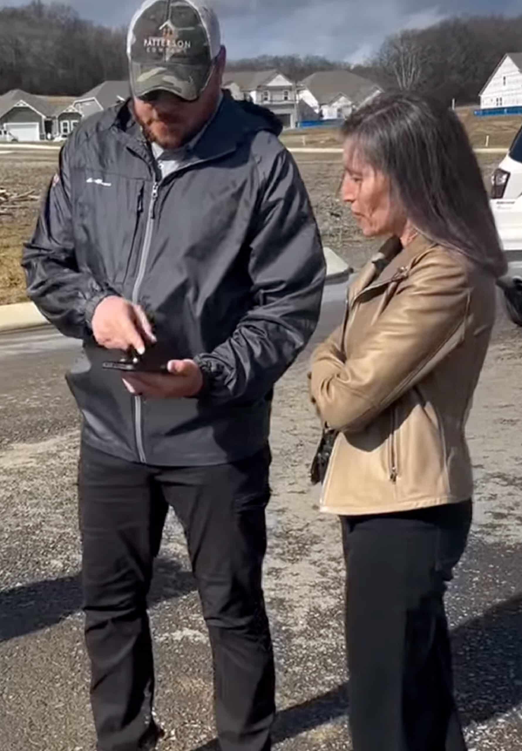 Two people looking over a development plan