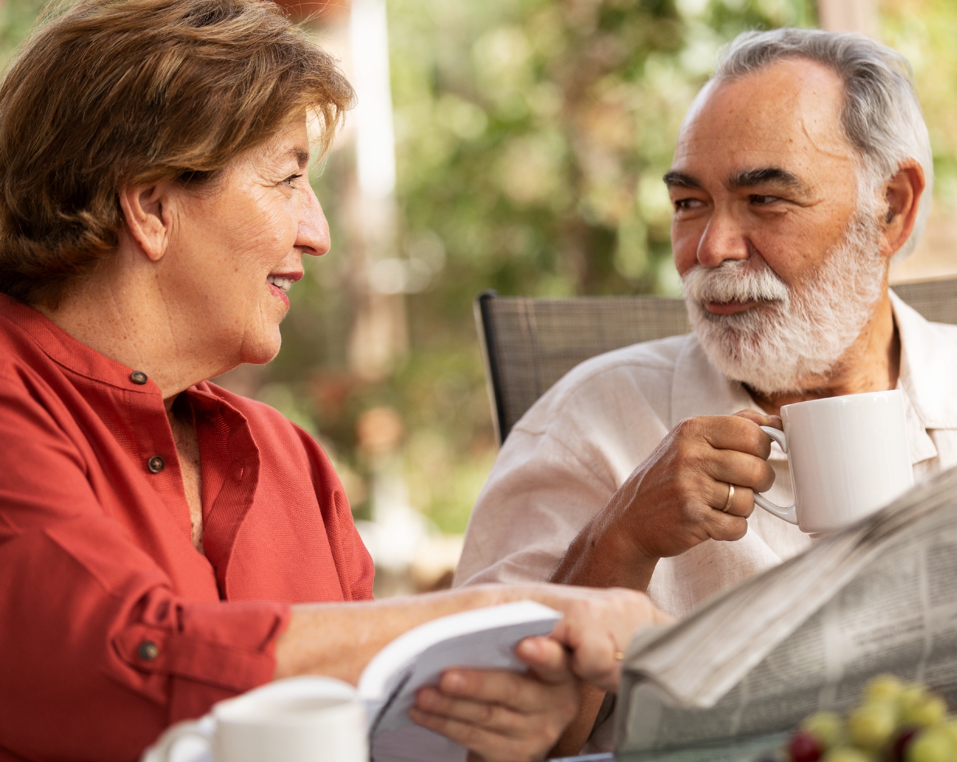 An older couple drinking coffee