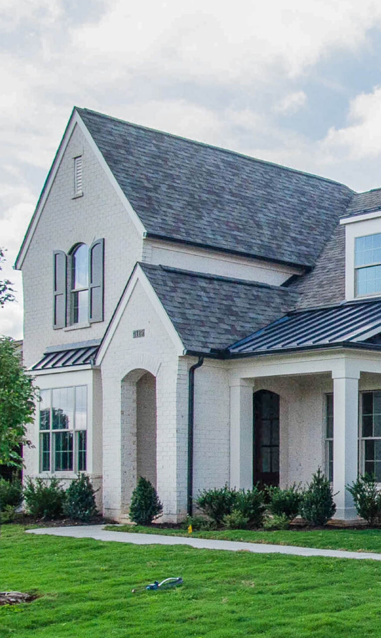 A white brick home built by Patterson Company