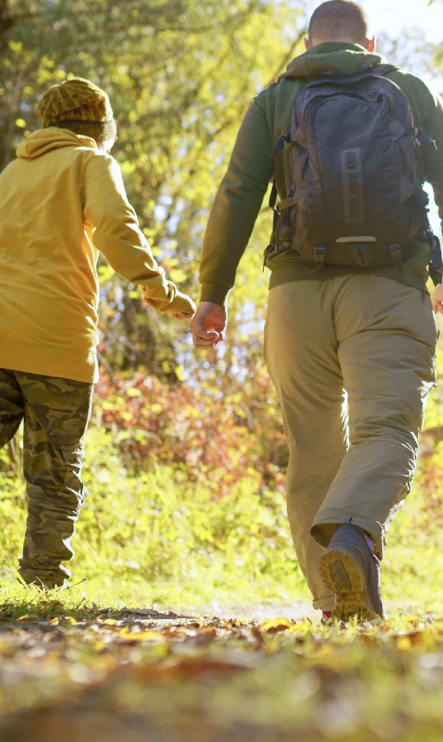 A couple walk down a trail