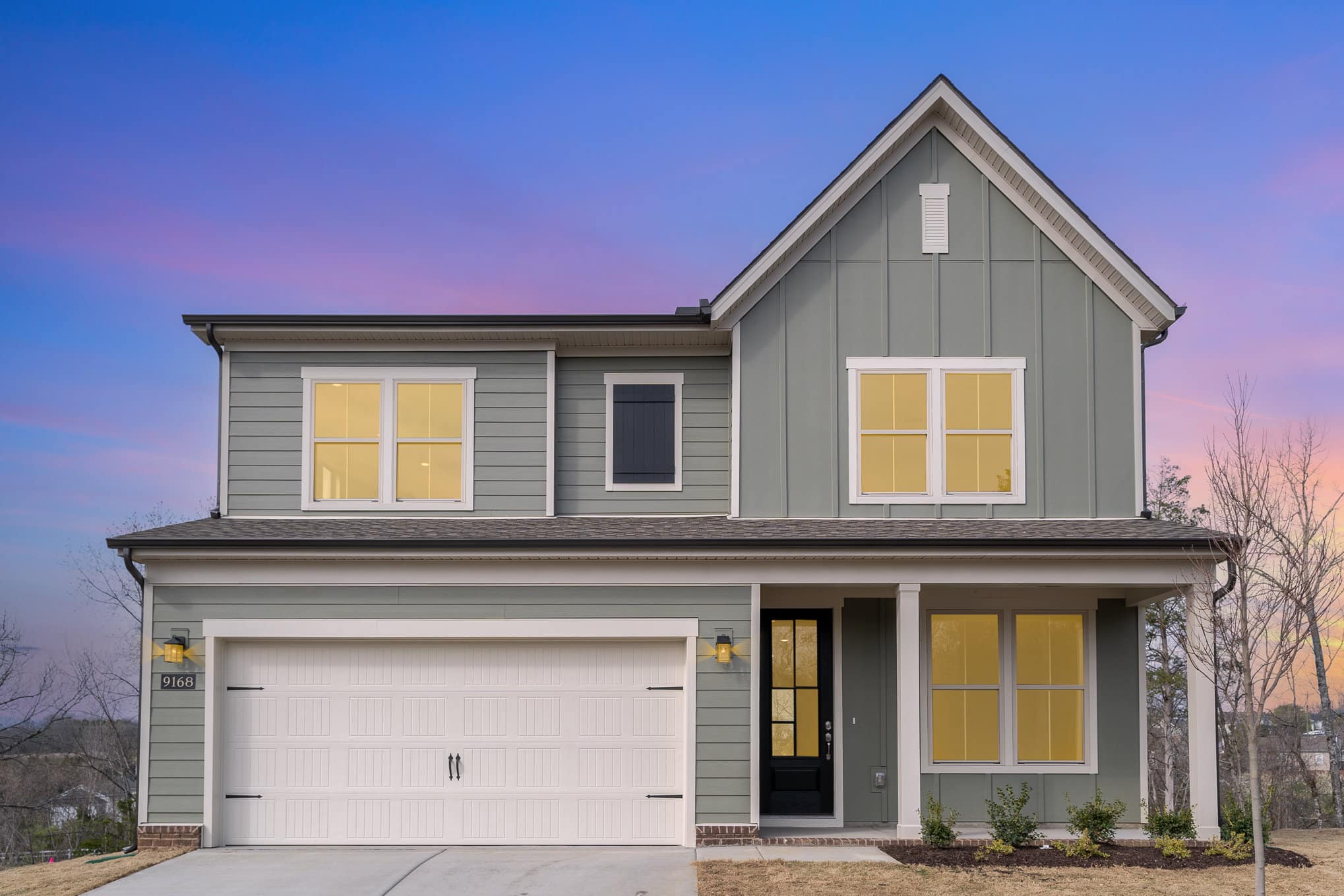 A light green painted home built by patterson company