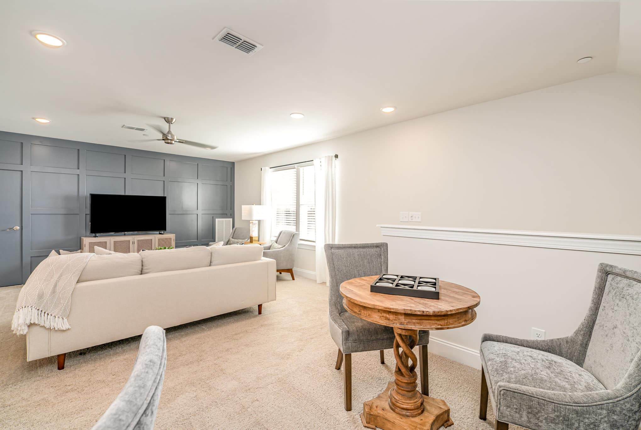 A game room in the Hanover series model home by Patterson Company