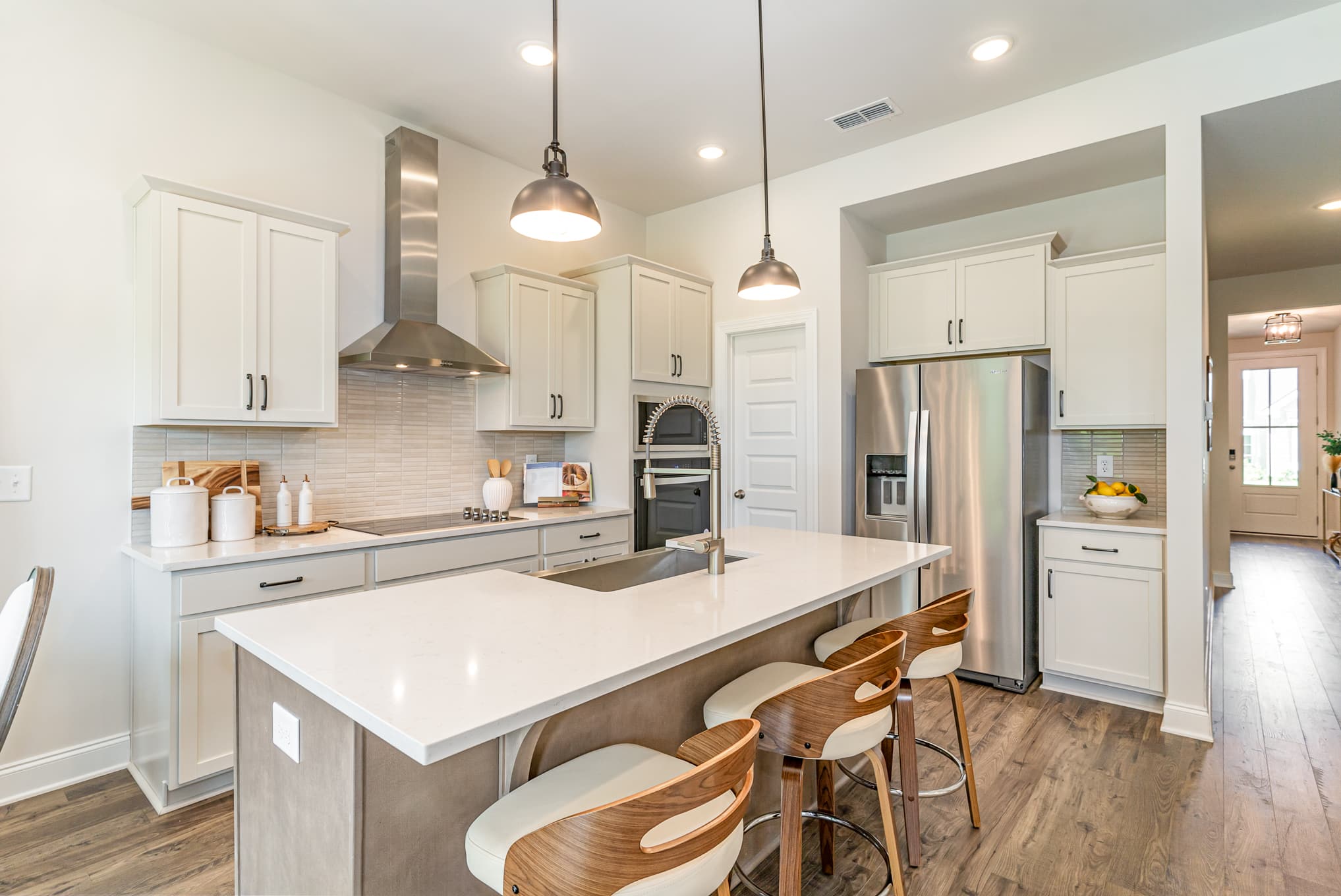 A kitchen area in the cambridge series home by patterson company