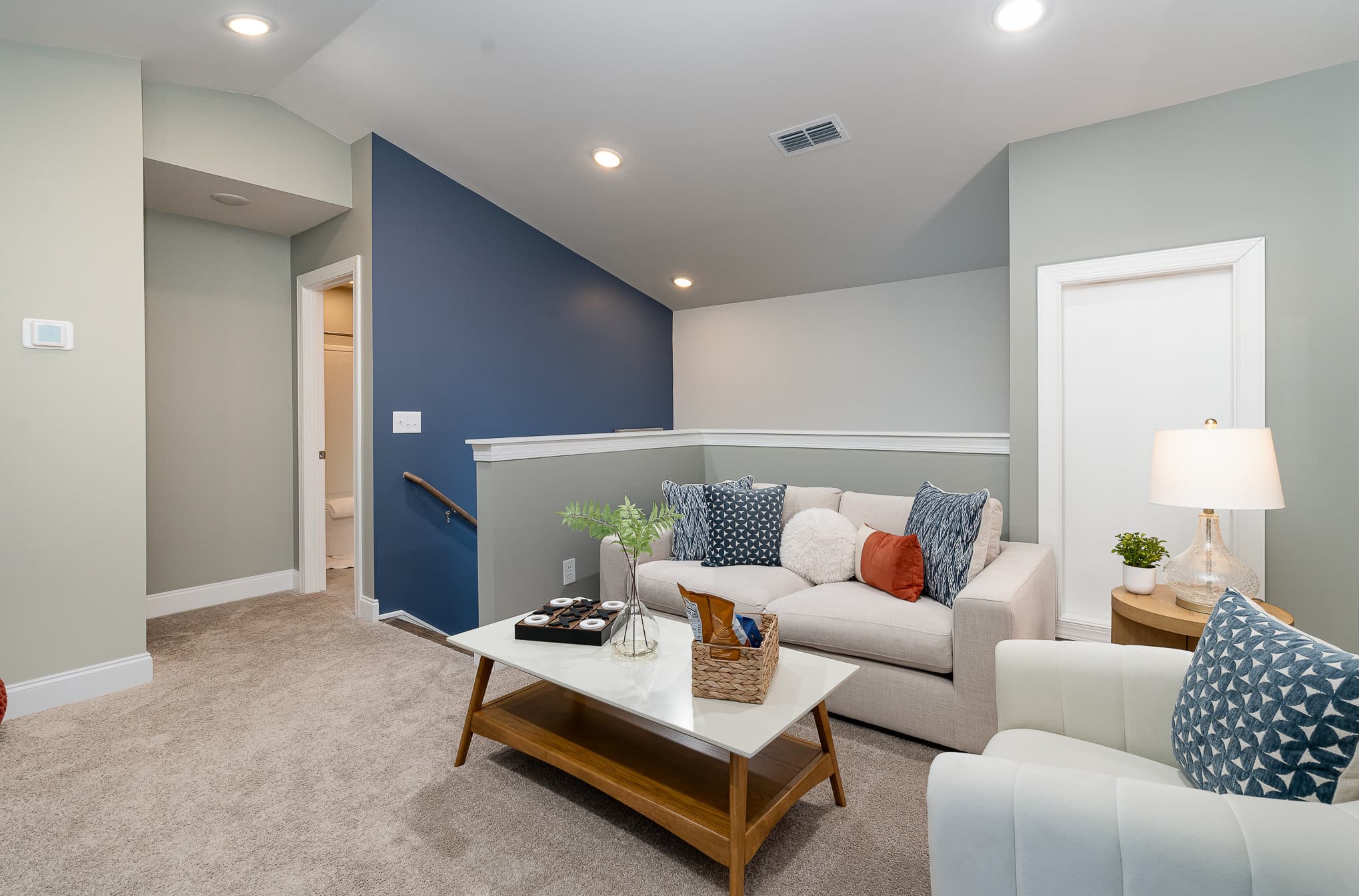 An upstairs living area in the cambridge series home by patterson company