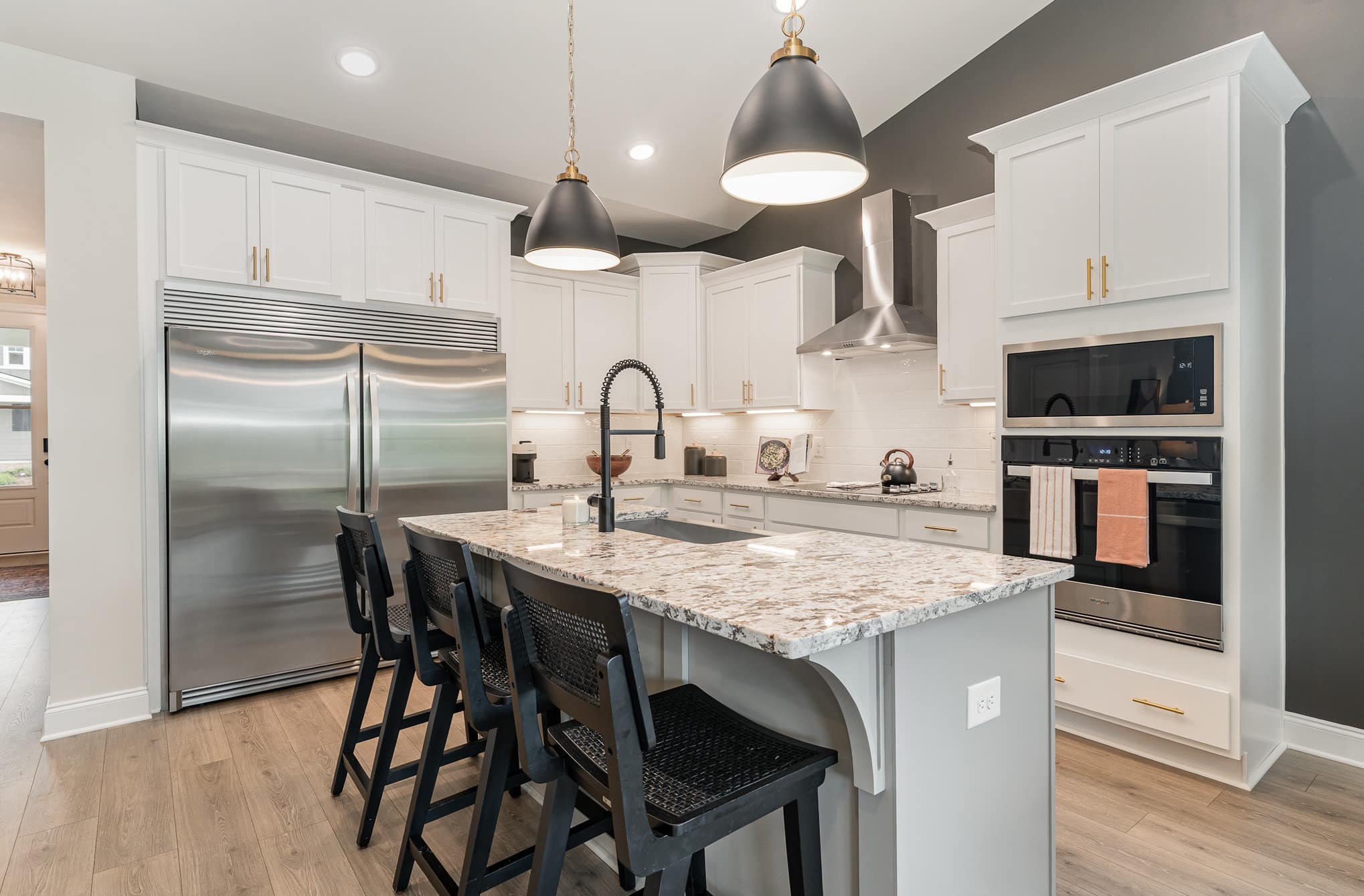 A kitchen island in a Harpeth series home by Patterson Company