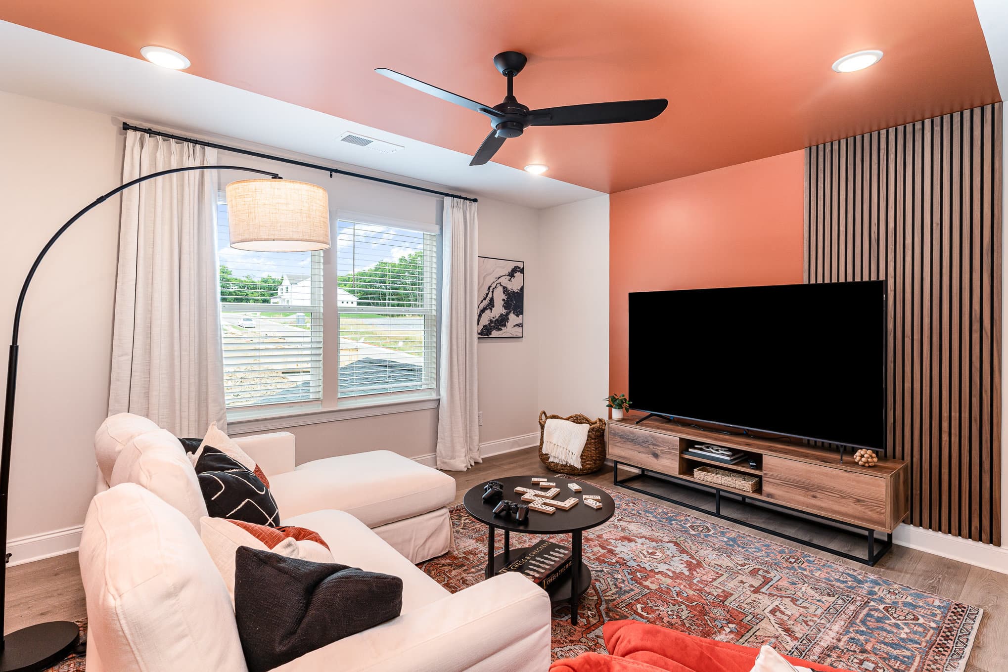 A tv room in a Harpeth series home by Patterson Company