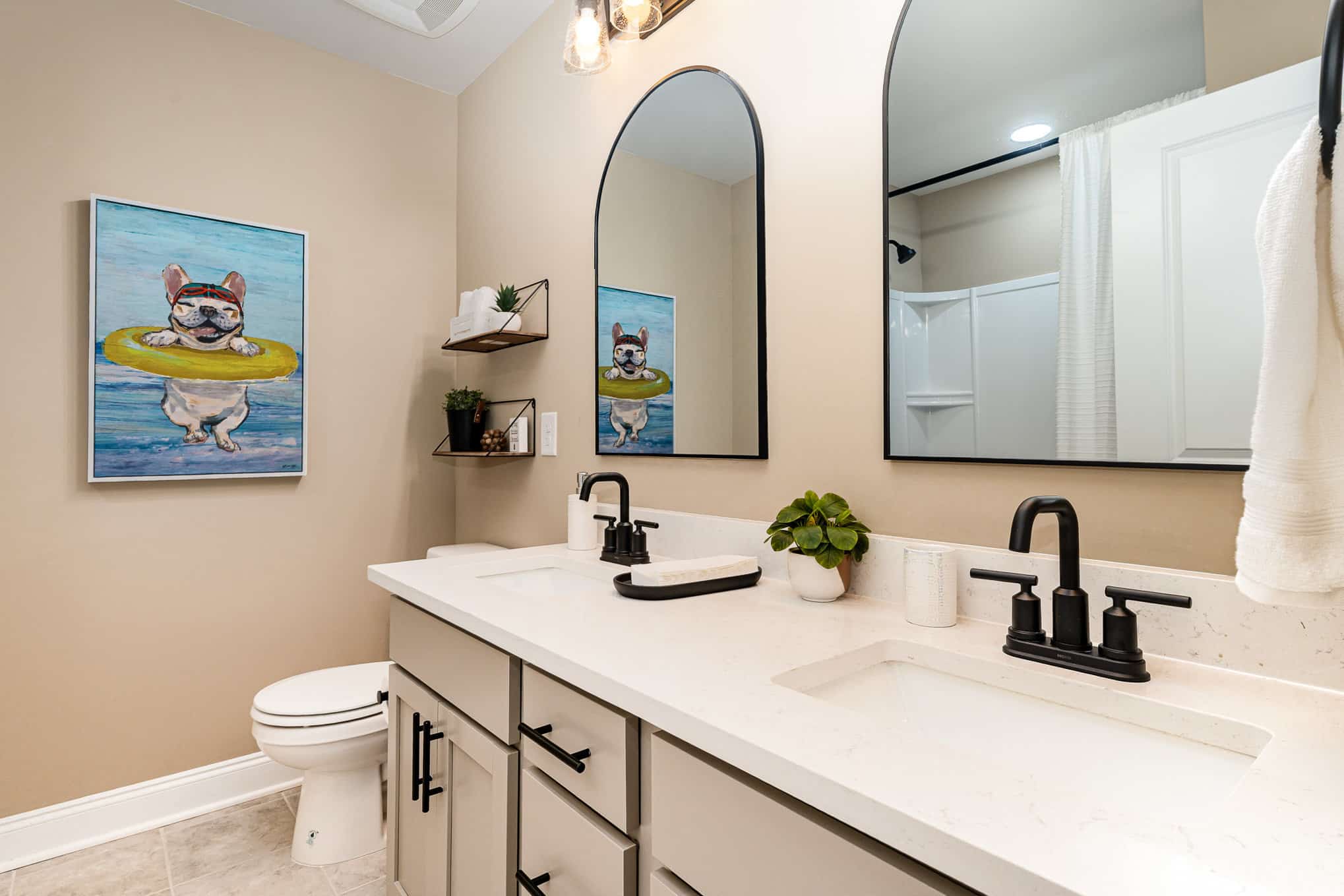 A bathroom with tan walls in a Harpeth series home by Patterson Company