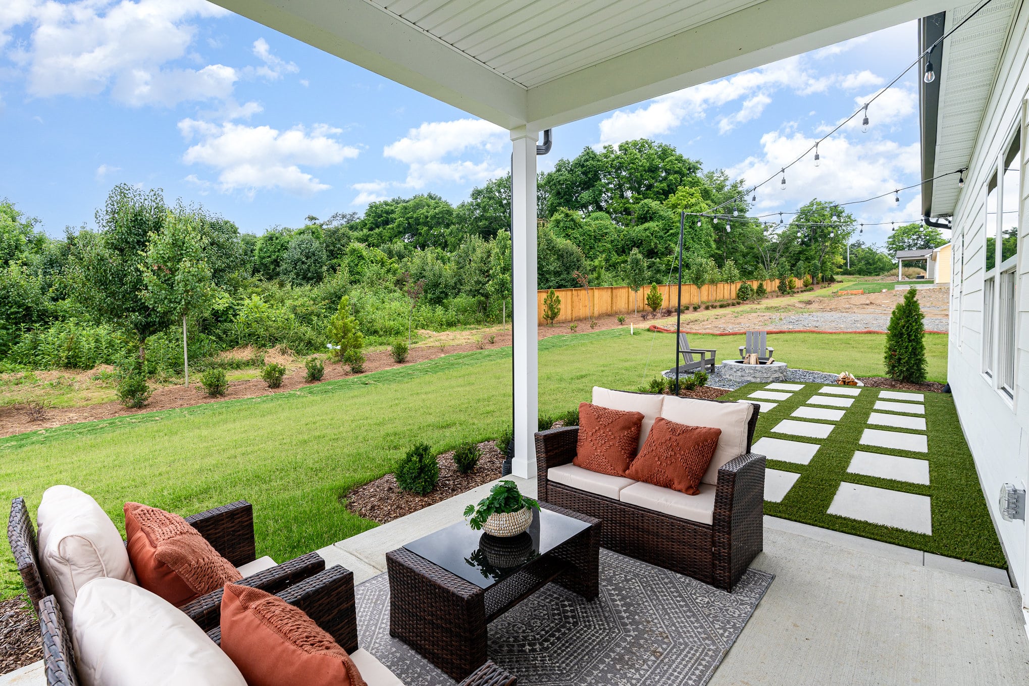 A covered patio area at a Harpeth series home by Patterson company